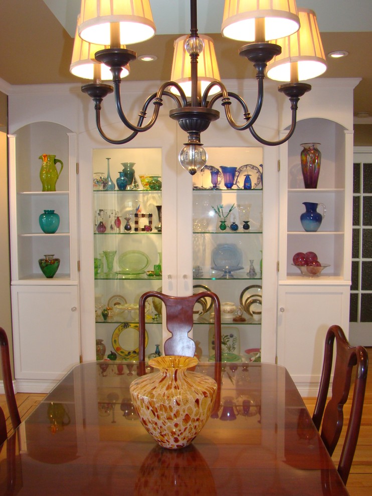 This is an example of a medium sized traditional dining room in Vancouver with beige walls and light hardwood flooring.
