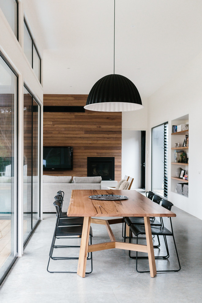 Trendy concrete floor great room photo in Geelong with white walls