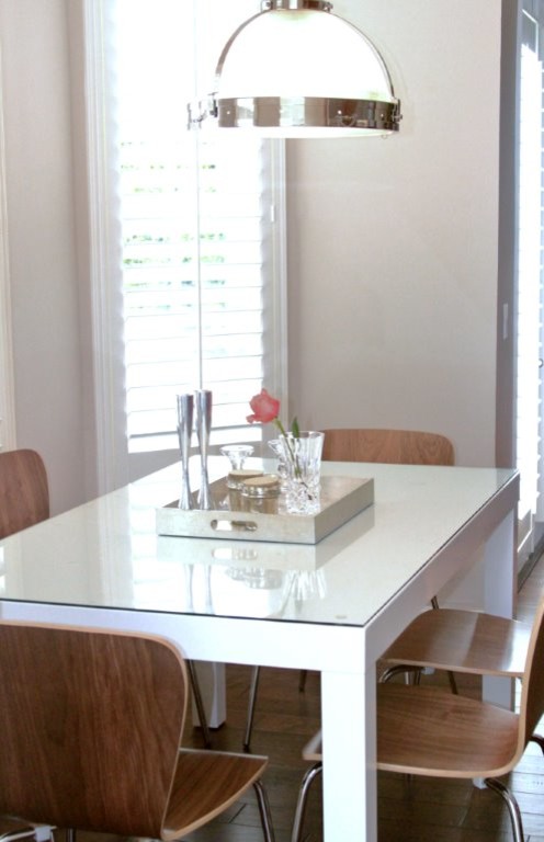 Photo of a medium sized traditional open plan dining room in Miami with beige walls and dark hardwood flooring.