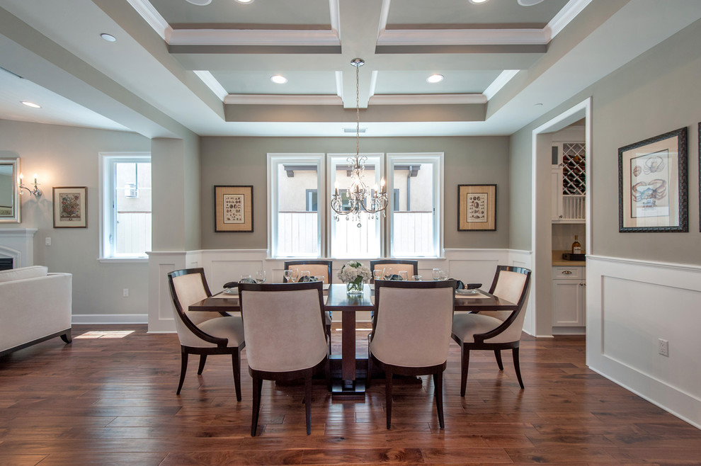 Photo of an expansive contemporary open plan dining room in Los Angeles with grey walls and medium hardwood flooring.