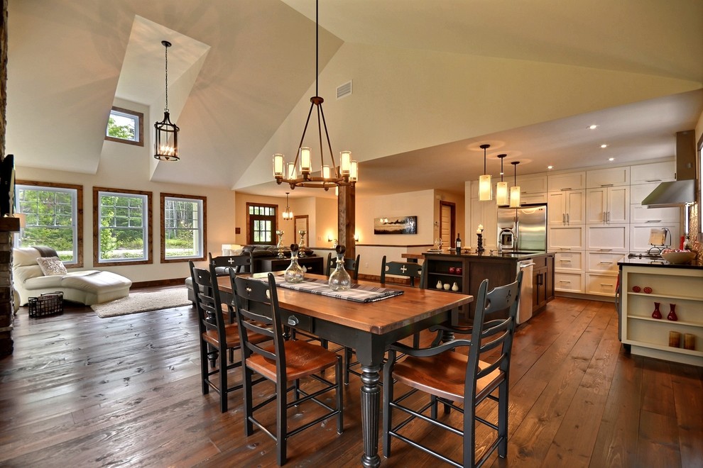 Example of a mountain style dining room design in Montreal