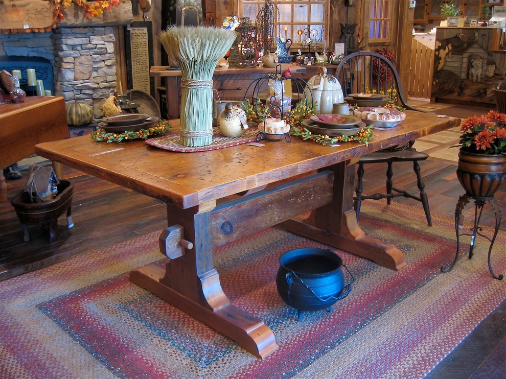 This is an example of a large rustic kitchen/dining room in New York with beige walls, carpet and no fireplace.