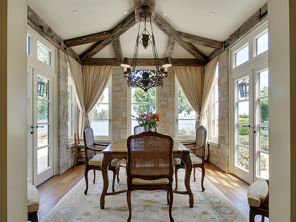 Inspiration for a traditional dining room in Seattle with medium hardwood flooring.