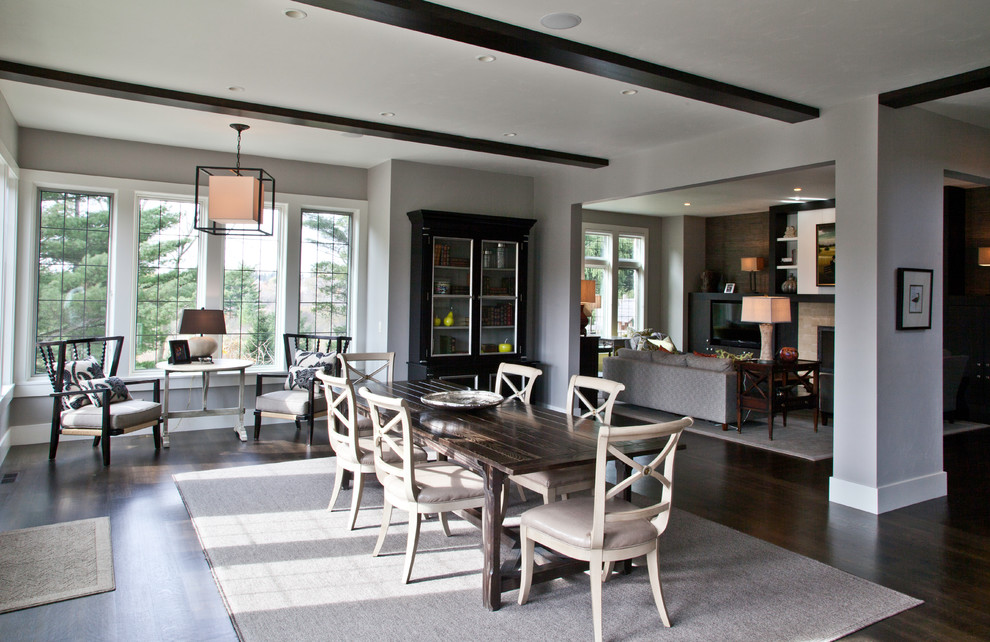 Enclosed dining room - large transitional dark wood floor enclosed dining room idea in Milwaukee with gray walls