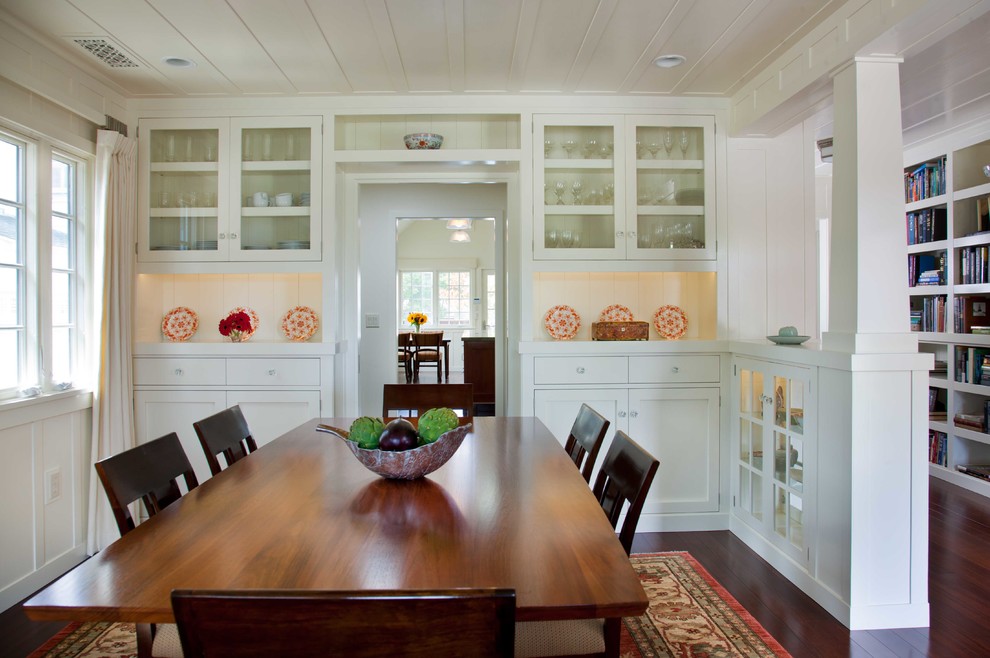 Enclosed dining room - mid-sized traditional dark wood floor and brown floor enclosed dining room idea in San Diego with white walls and no fireplace