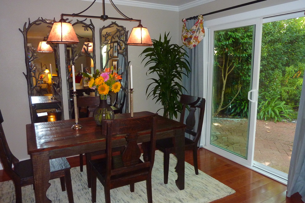 Example of a small eclectic dark wood floor dining room design in Santa Barbara