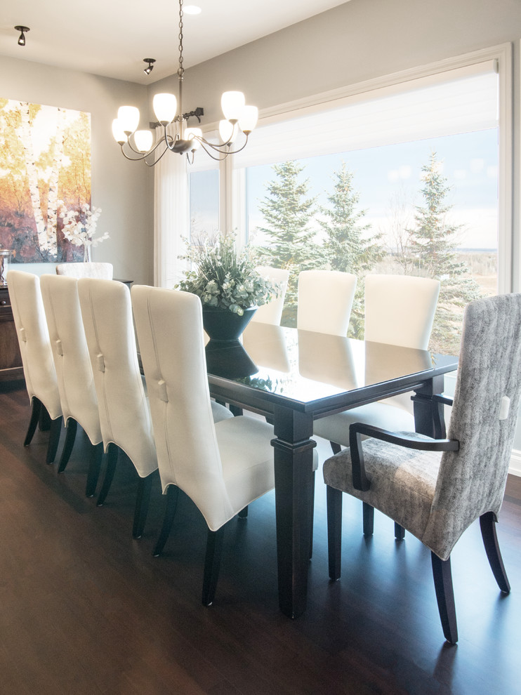 Example of a transitional dark wood floor dining room design in Calgary