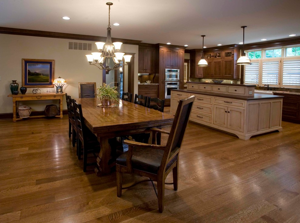 Inspiration for a mid-sized craftsman medium tone wood floor kitchen/dining room combo remodel in Other with beige walls and no fireplace