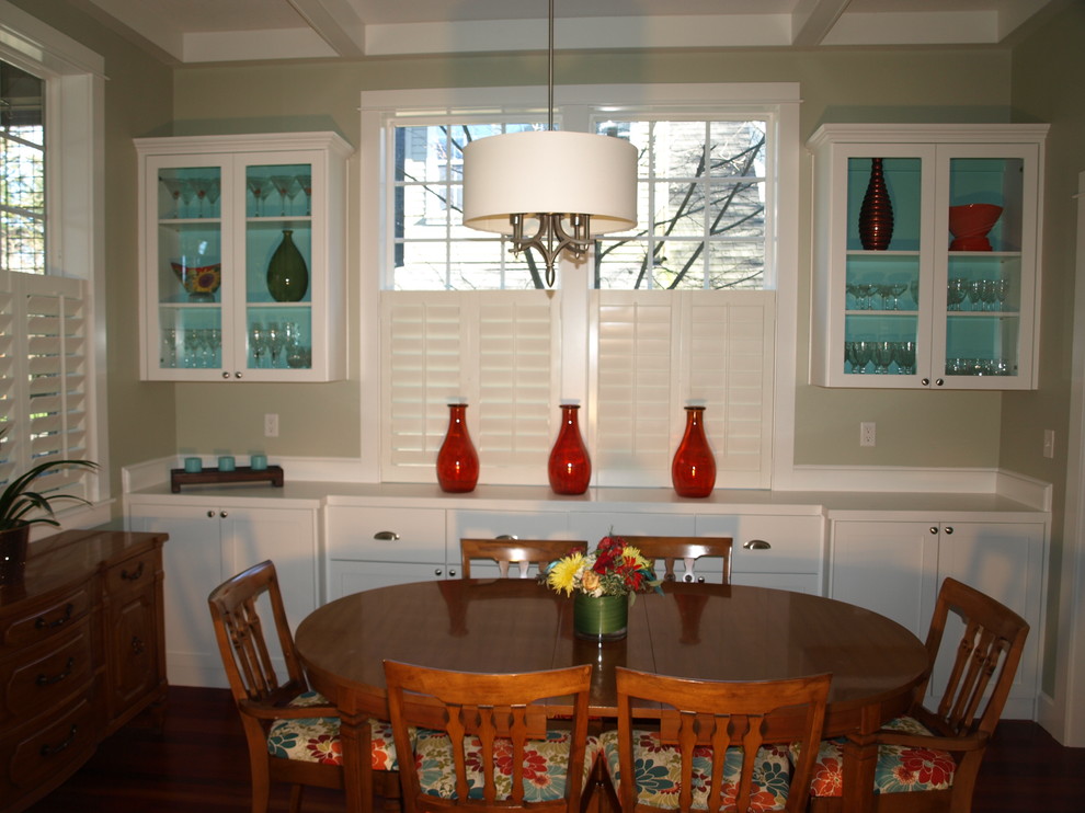 Photo of a small traditional enclosed dining room in Portland with green walls.