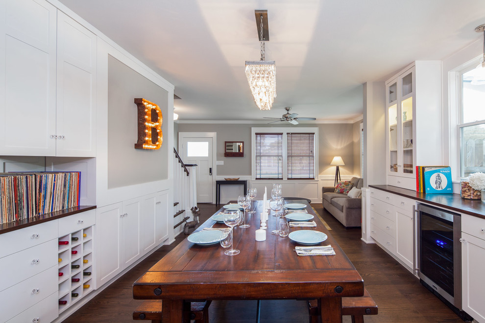 Medium sized classic kitchen/dining room in Austin with white walls and medium hardwood flooring.