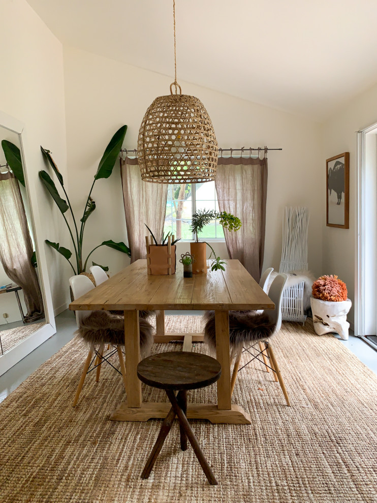 Photo of a medium sized scandinavian enclosed dining room in San Francisco with beige walls and grey floors.