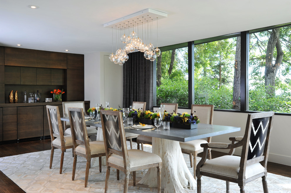 Large trendy dark wood floor and brown floor enclosed dining room photo in San Francisco with beige walls