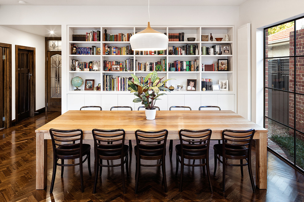 Example of a classic dark wood floor dining room design in Melbourne with white walls