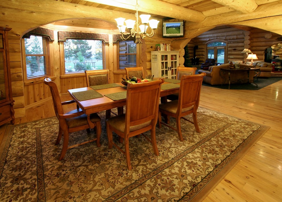 Design ideas for a large rustic kitchen/dining room in Other with light hardwood flooring and no fireplace.