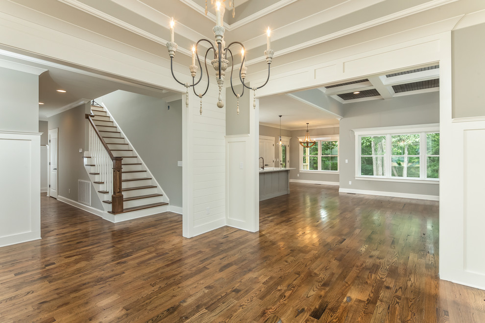 Example of a large classic dark wood floor enclosed dining room design in Other with gray walls and no fireplace