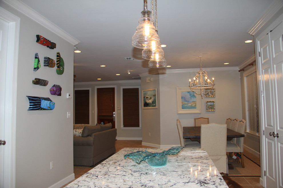 Kitchen/dining room combo - coastal ceramic tile kitchen/dining room combo idea in Miami with beige walls