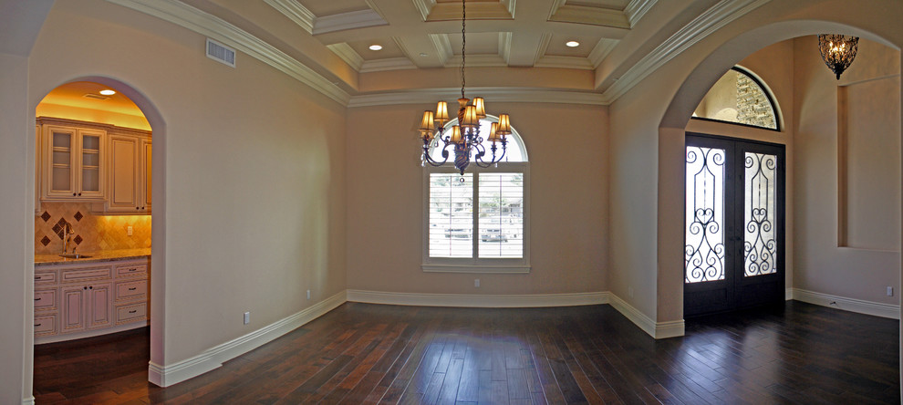 Traditional open plan dining room in Other with beige walls and dark hardwood flooring.