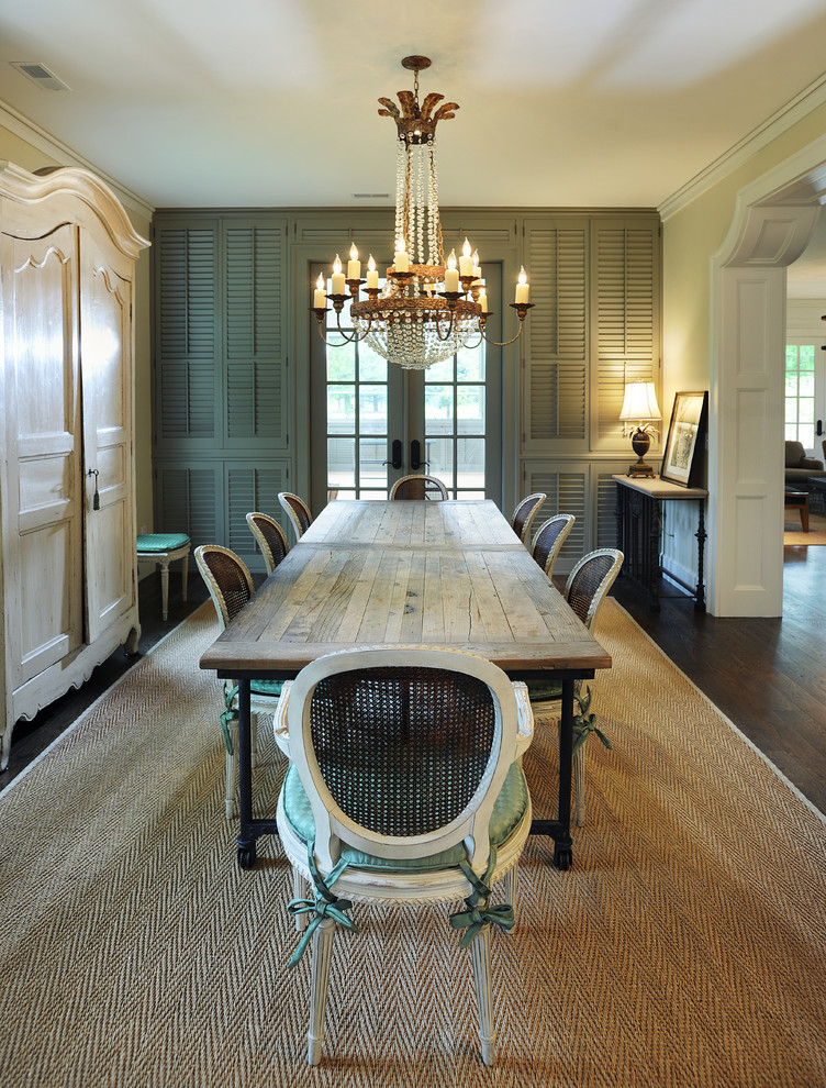 Example of a classic dark wood floor enclosed dining room design in Nashville with beige walls