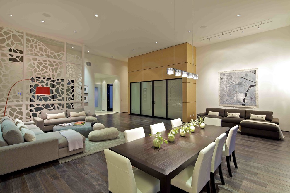 Design ideas for a contemporary open plan dining room in San Diego with feature lighting.