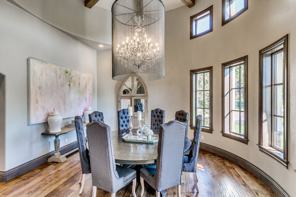 This is an example of a large classic enclosed dining room in Oklahoma City with grey walls, no fireplace, medium hardwood flooring and brown floors.