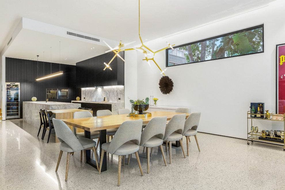 Свежая идея для дизайна: большая гостиная-столовая в стиле модернизм с белыми стенами, бетонным полом и белым полом - отличное фото интерьера