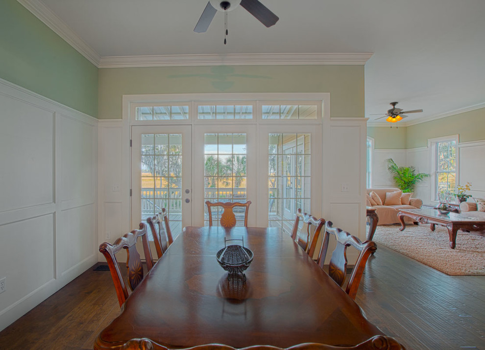 Inspiration for a medium sized classic open plan dining room in Charleston with green walls and dark hardwood flooring.