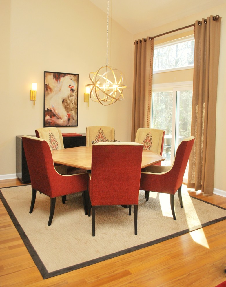Medium sized contemporary kitchen/dining room in New York with beige walls, light hardwood flooring and no fireplace.