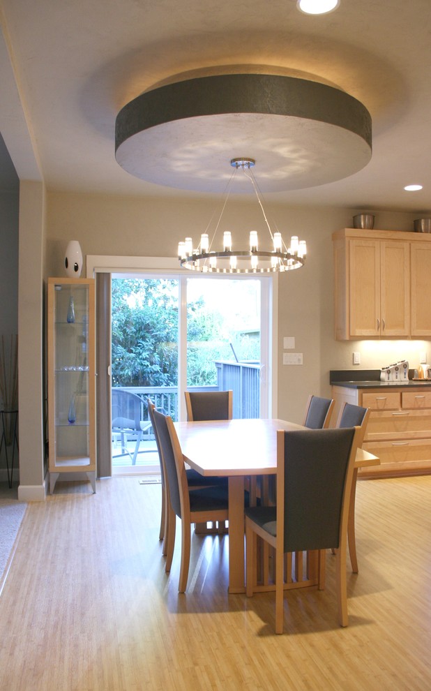 Kitchen/dining room combo - mid-sized modern bamboo floor kitchen/dining room combo idea in Portland with gray walls