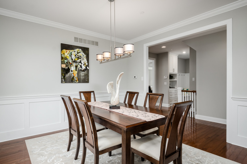 Inspiration for a craftsman dark wood floor and brown floor dining room remodel in Philadelphia with gray walls