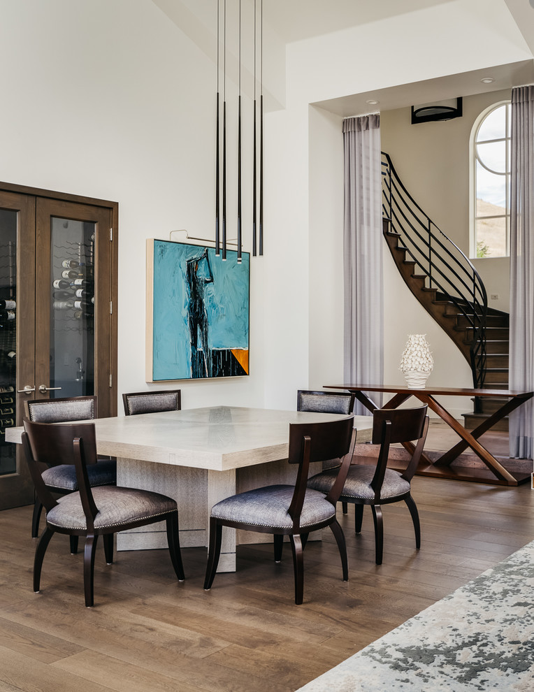 Example of a large transitional dark wood floor and brown floor dining room design in San Francisco with white walls and no fireplace