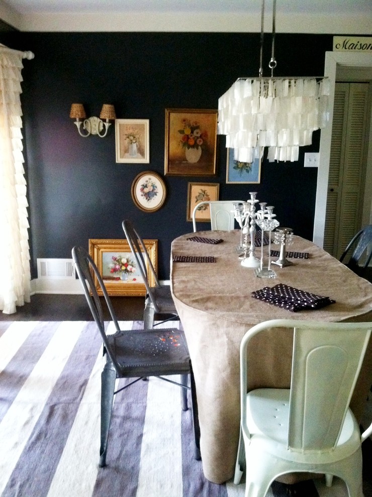 This is an example of an eclectic dining room in Atlanta.