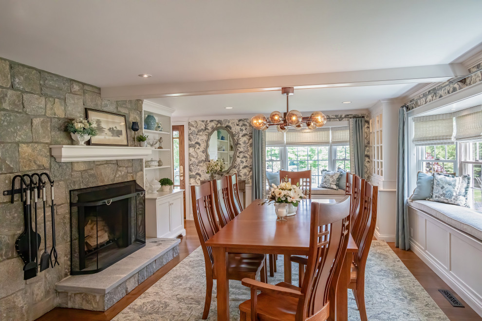 Inspiration for a mid-sized coastal medium tone wood floor, brown floor, exposed beam and wallpaper enclosed dining room remodel in Bridgeport with blue walls, a standard fireplace and a stone fireplace