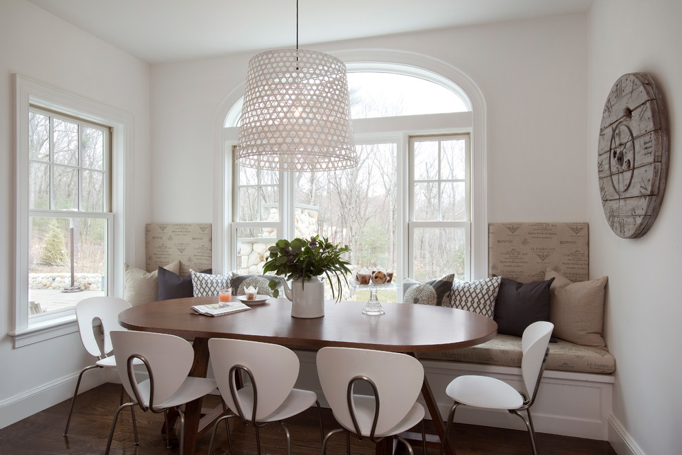 This is an example of a large traditional open plan dining room in Boston with limestone flooring, beige floors and white walls.