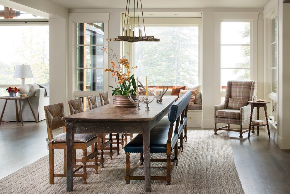 Example of a mountain style medium tone wood floor great room design in Seattle with gray walls