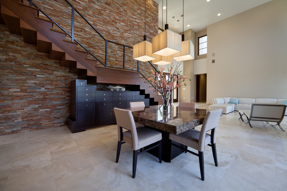 This is an example of a contemporary dining room in Orlando with beige walls.