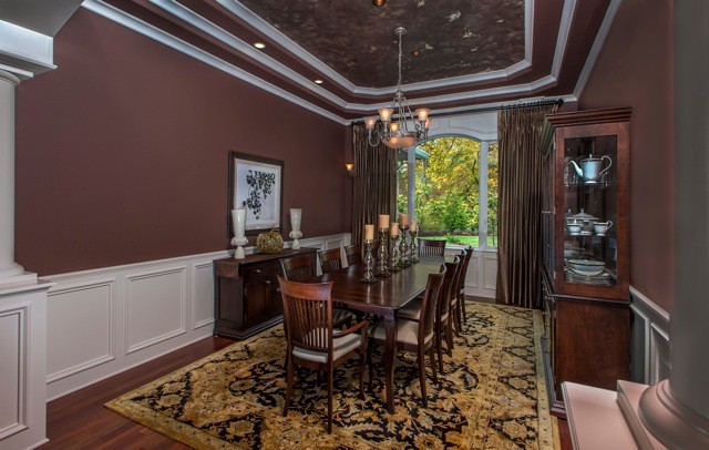 Inspiration for a large mediterranean enclosed dining room in Seattle with purple walls, dark hardwood flooring and brown floors.