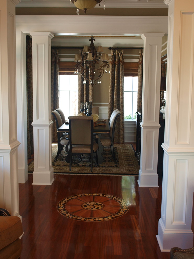 Design ideas for a medium sized classic dining room in Charleston with brown walls, dark hardwood flooring and no fireplace.