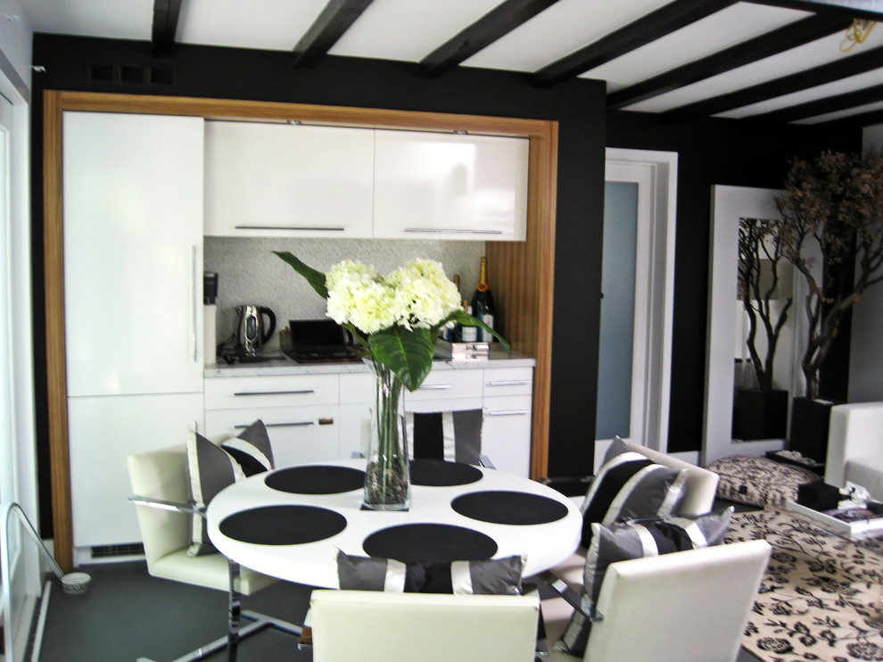 Mittelgroße Moderne Wohnküche mit grauer Wandfarbe und Betonboden in Los Angeles