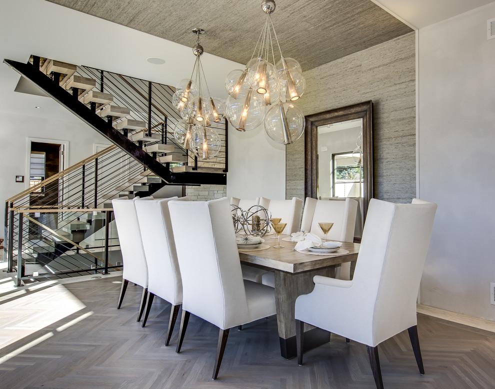 Contemporary dining room in Denver with grey walls.
