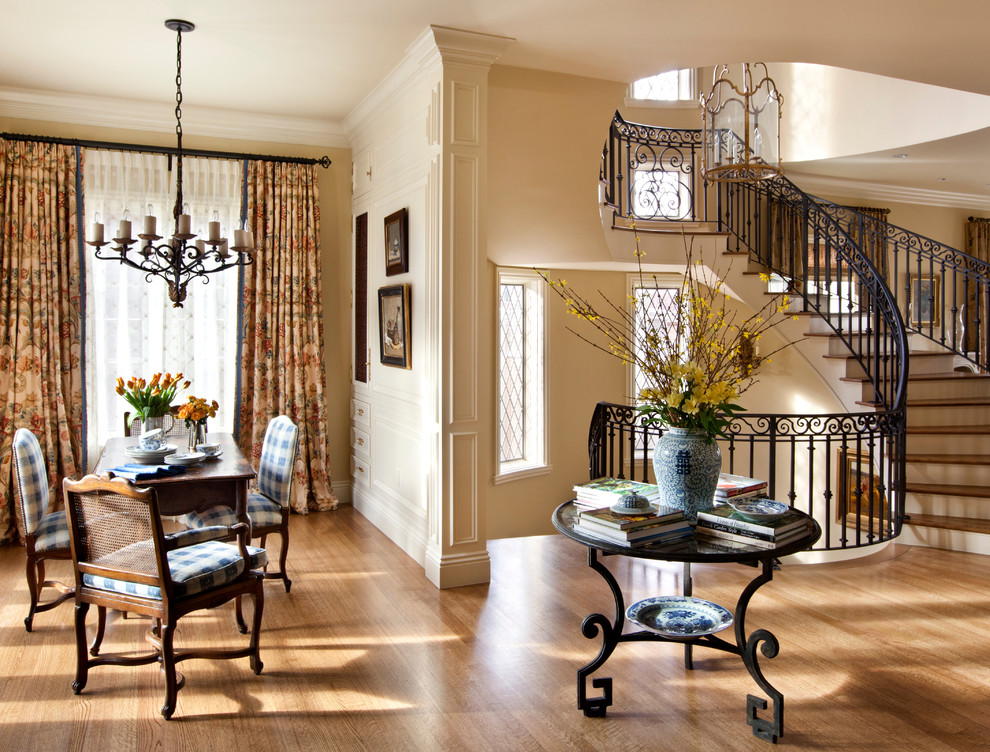 Example of a mid-sized classic light wood floor great room design in Denver with beige walls