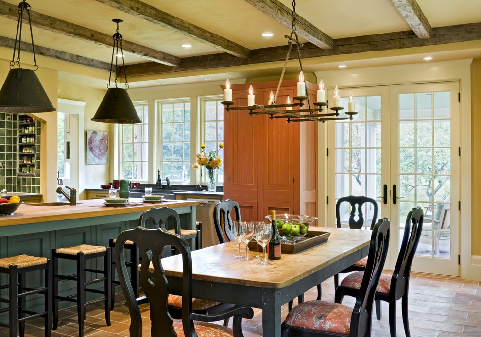 Inspiration for a kitchen/dining room in Burlington with yellow walls.