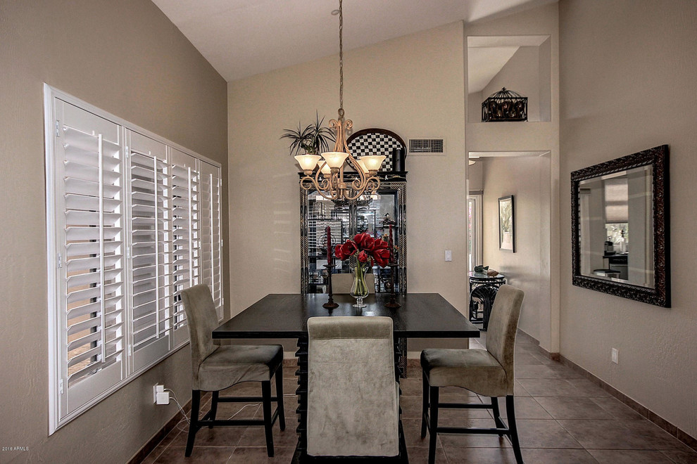 Inspiration for a medium sized mediterranean open plan dining room in Phoenix with beige walls and ceramic flooring.