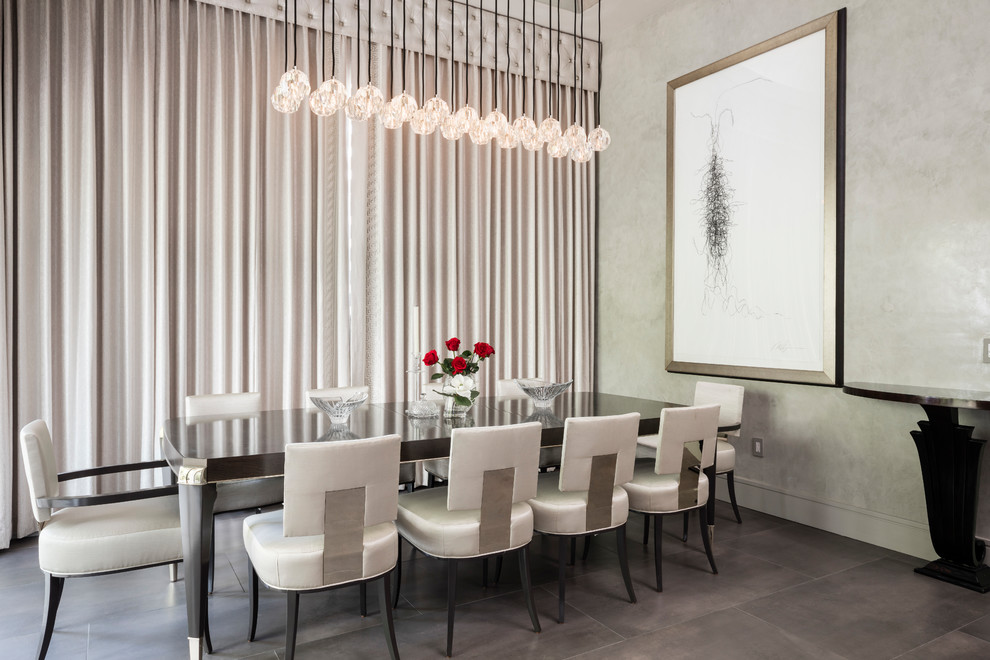 This is an example of a large contemporary enclosed dining room in Orlando with beige walls, porcelain flooring and grey floors.