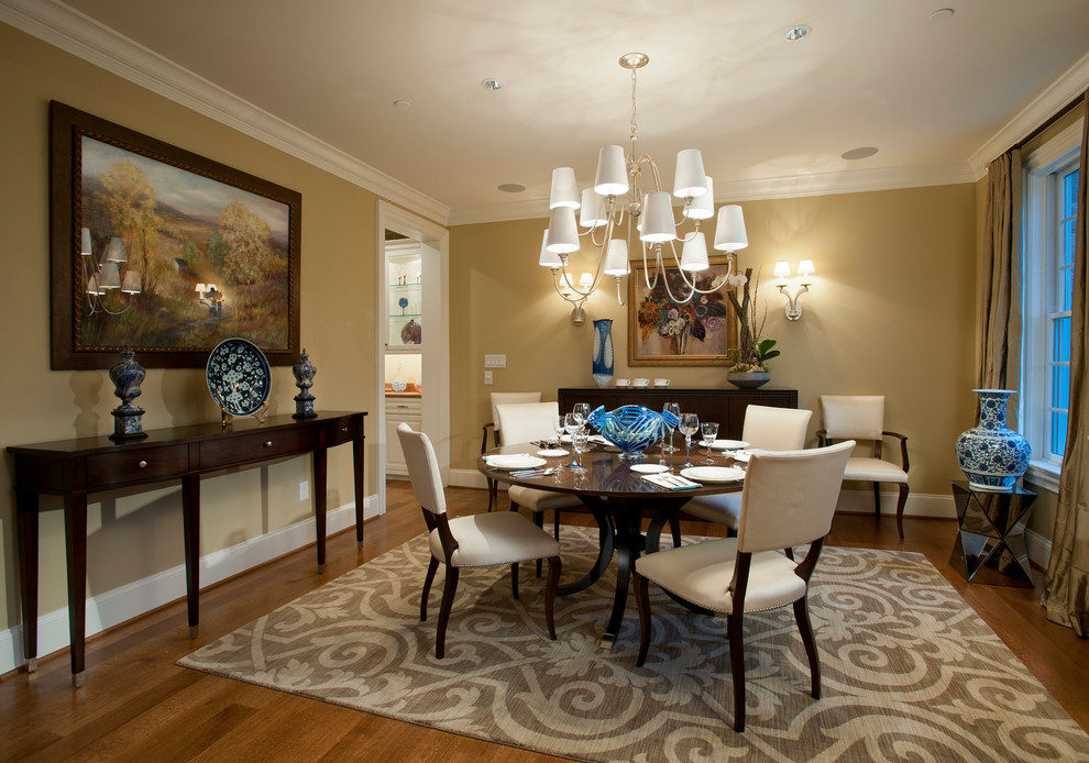 Design ideas for a classic enclosed dining room in Philadelphia with beige walls and medium hardwood flooring.