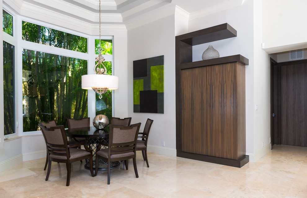 Photo of a contemporary dining room in Miami with white walls.