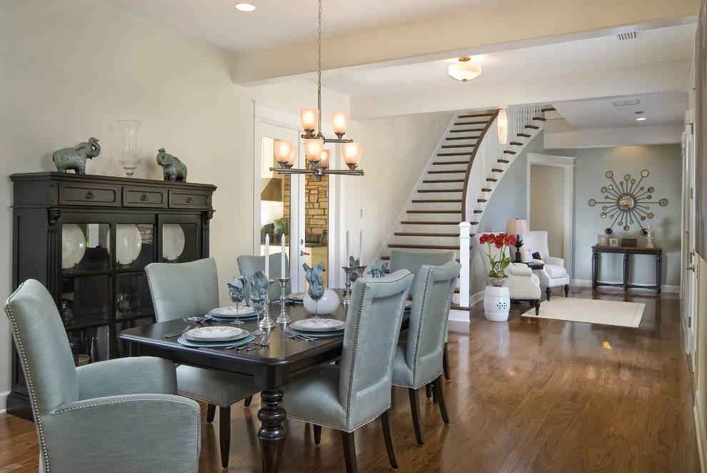 Dining room - contemporary medium tone wood floor dining room idea in Other with beige walls