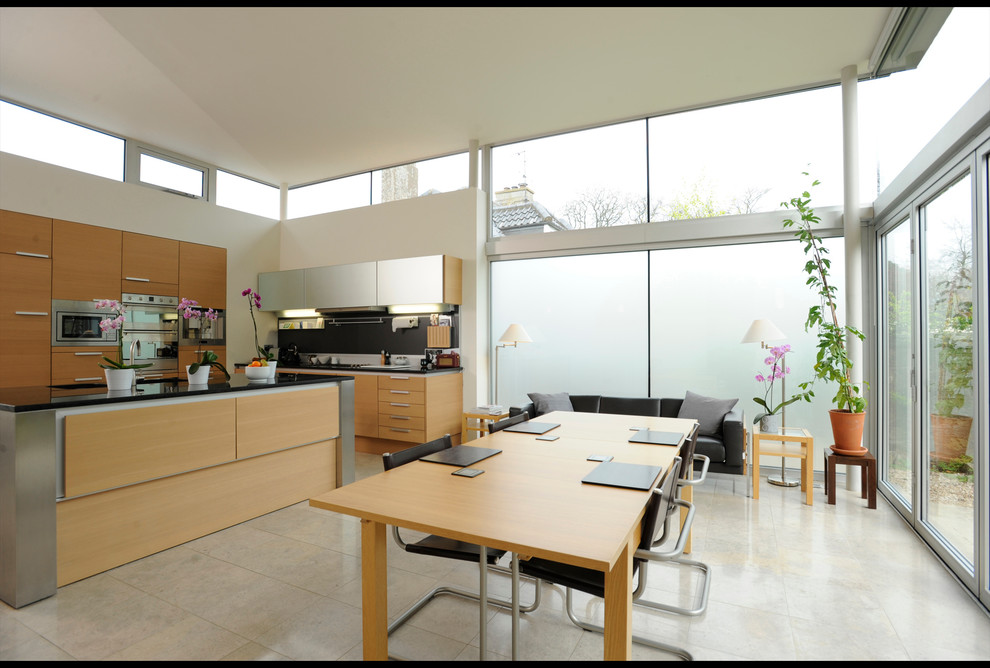 Medium sized contemporary kitchen/dining room in Edinburgh with white walls and porcelain flooring.