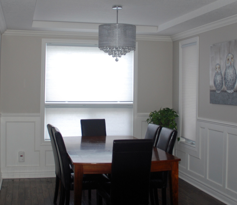 Photo of a contemporary dining room in Toronto with medium hardwood flooring.
