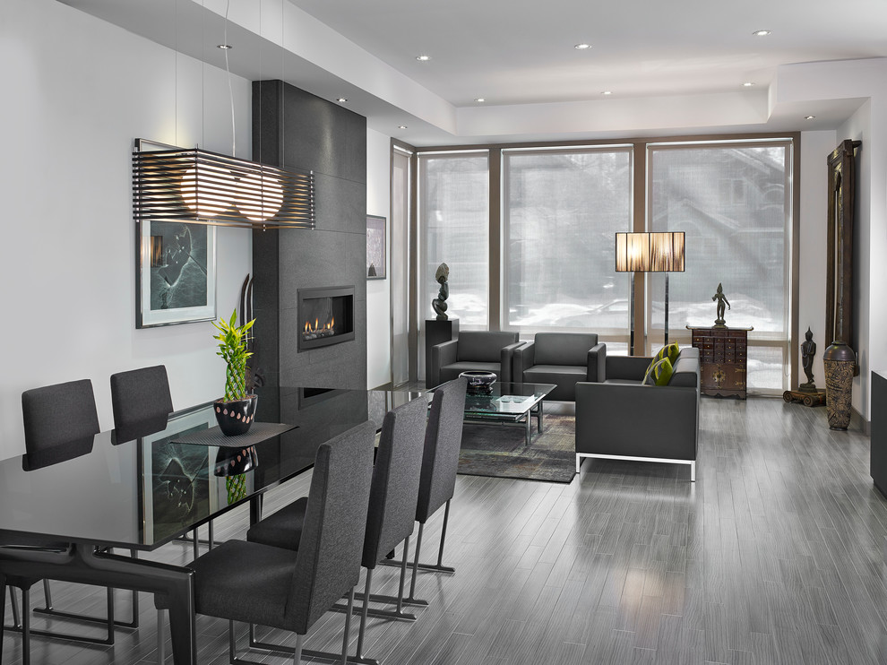 This is an example of a contemporary dining room in Edmonton with white walls.