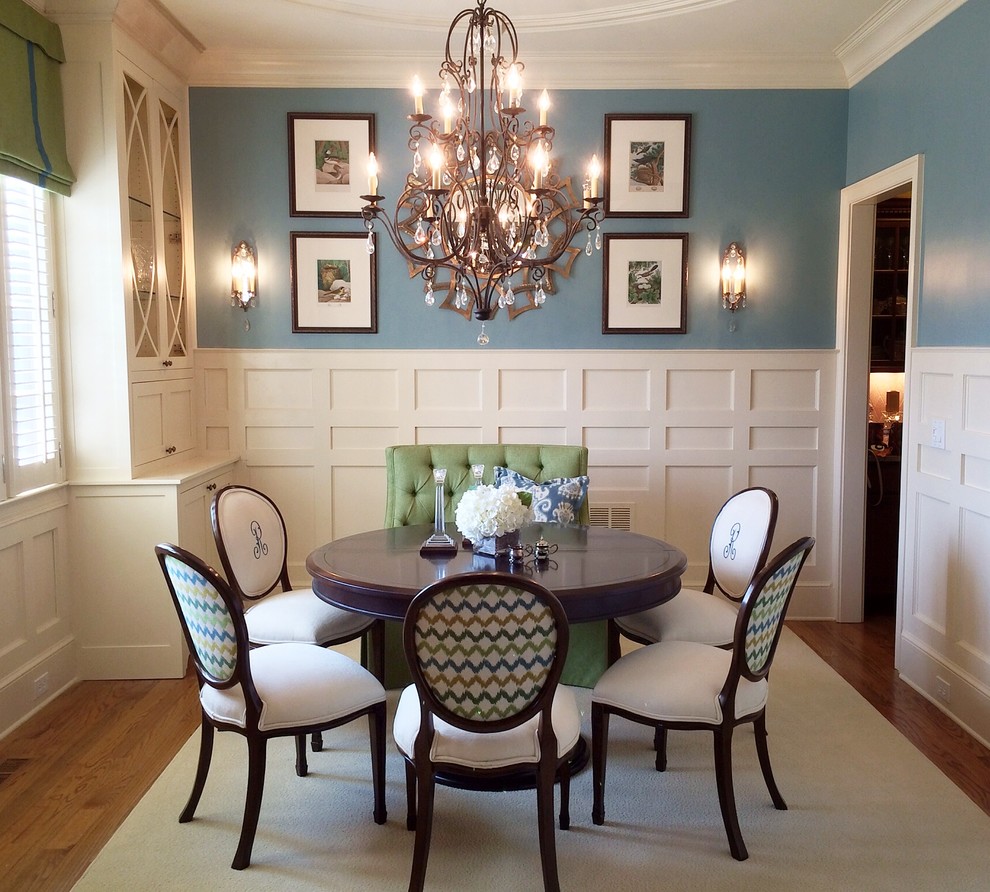 Mid-sized elegant medium tone wood floor enclosed dining room photo in Atlanta with blue walls and no fireplace